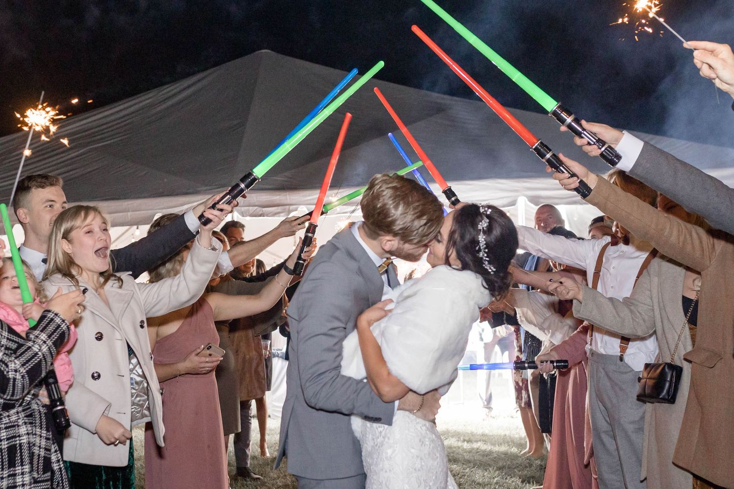 bride and groom kiss during exit