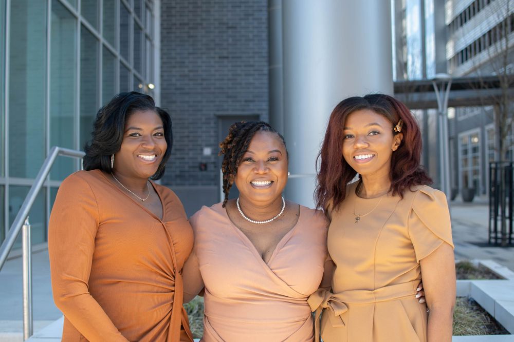 Group of Three Woman in Front of Building