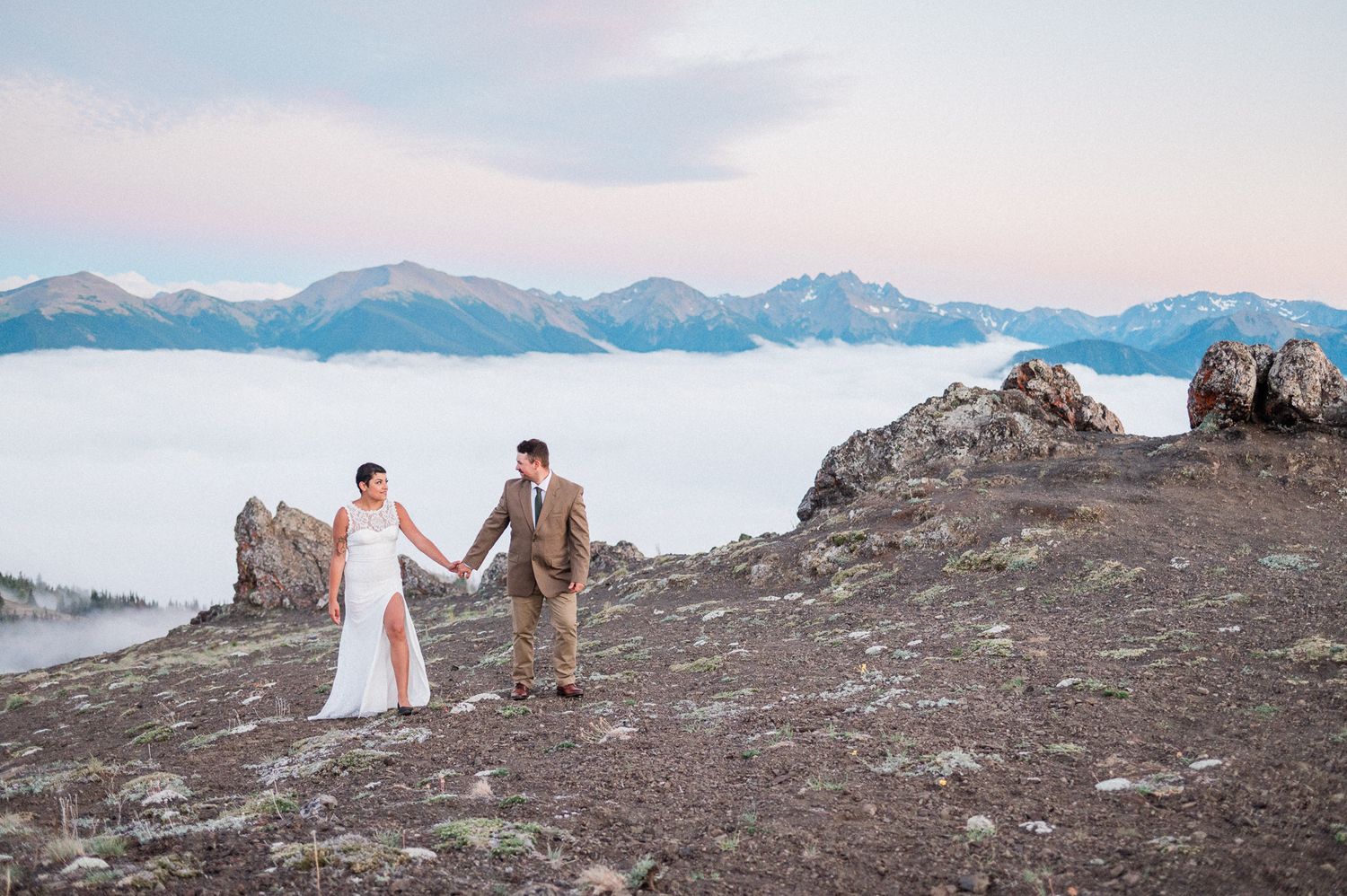 Bride and groom exploring Olympic National Park at sunset. Photo by Pine + Vow.