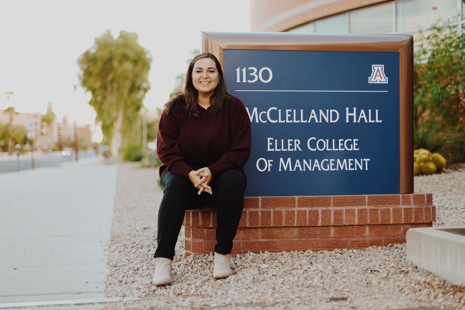 Outdoor campus signage for McClelland Hall and Eller College of Management.