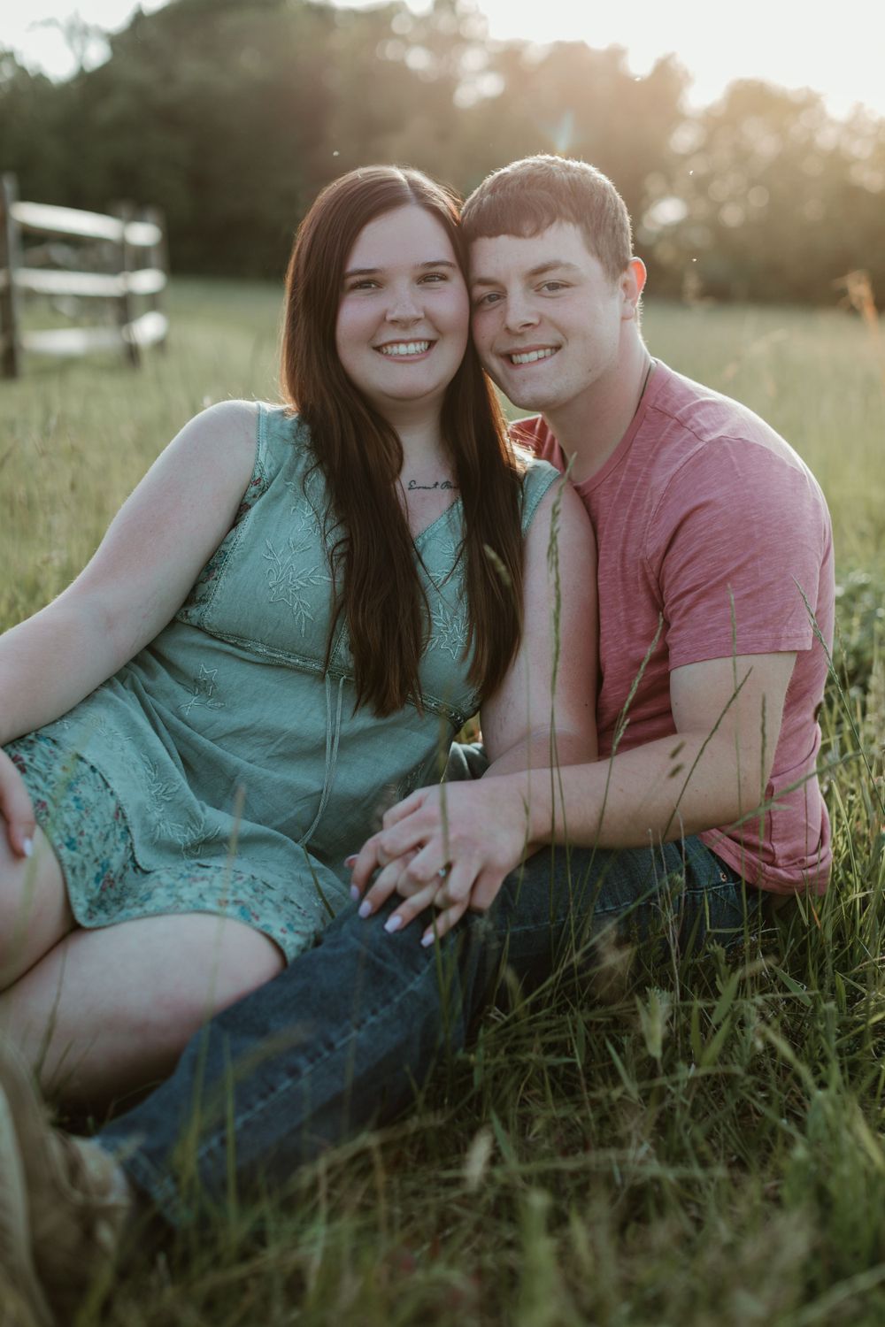 Candid couple photos in grassy field during golden hour.