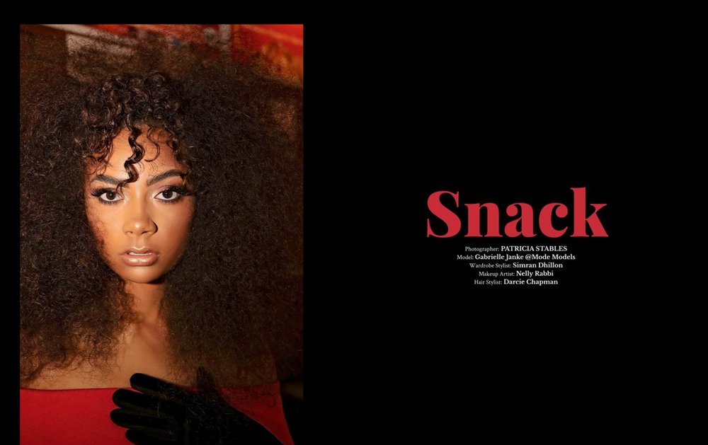 Fashion editorial photo against red background with text saying Snack.