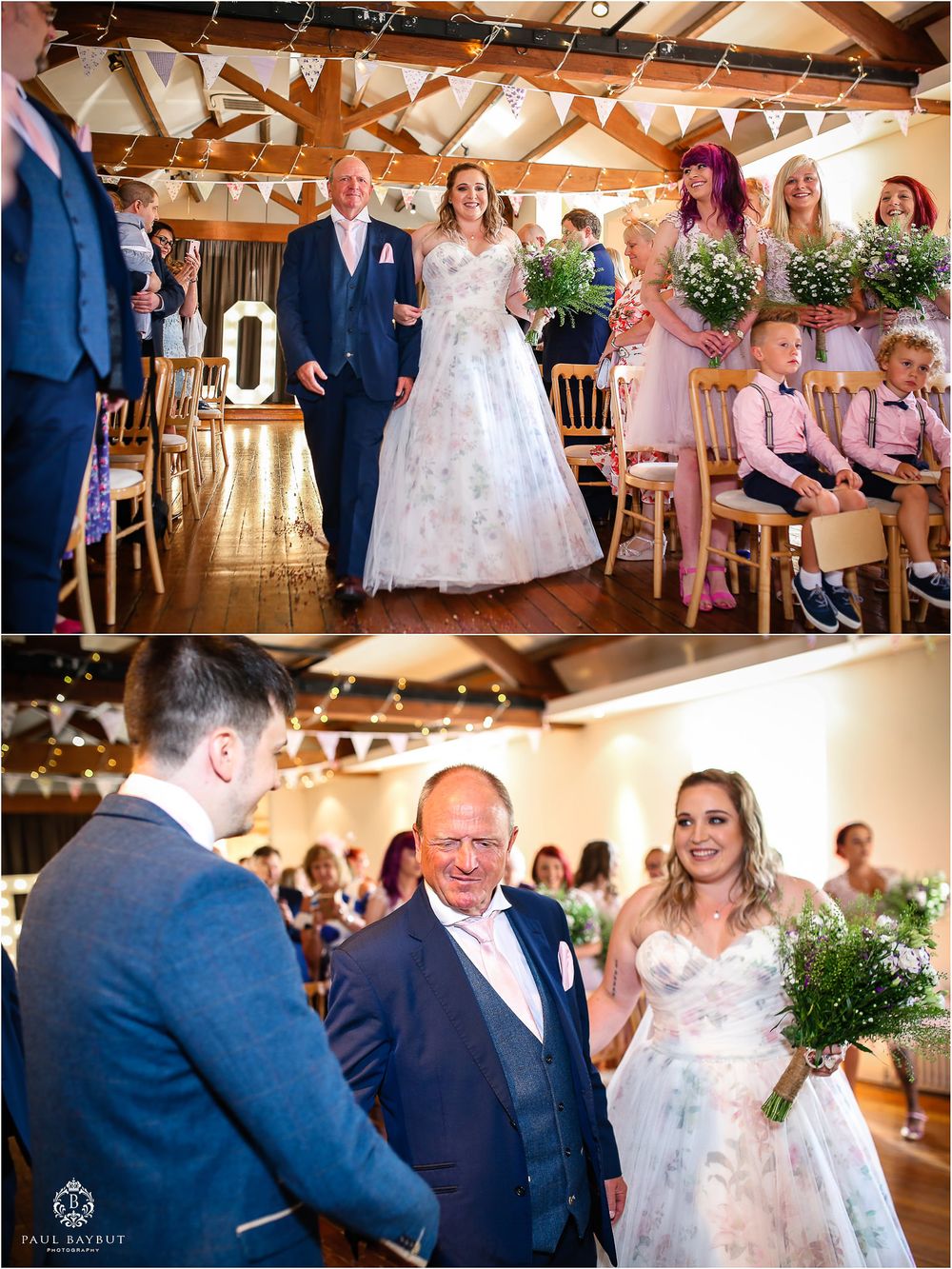 Wedding ceremony in a rustic venue decorated with white bunting and wooden beams.