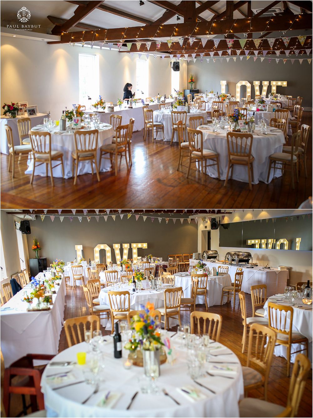 Elegant wedding reception venue with white-clothed tables, wooden chairs and LOVE letters on display.