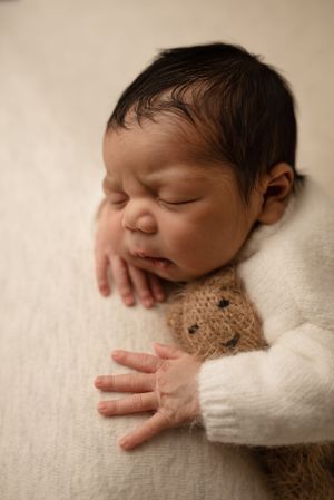 Baby boy snuggled with little bear -Pueblo, Colorado Newborn Photographer