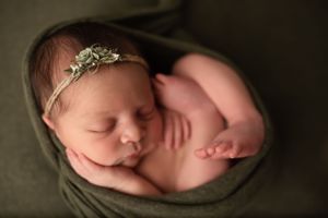 Newborn girl in green wrap -Pueblo, Colorado Newborn Photographer