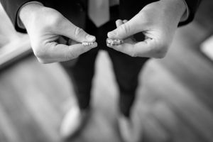 groom with rings at wedding