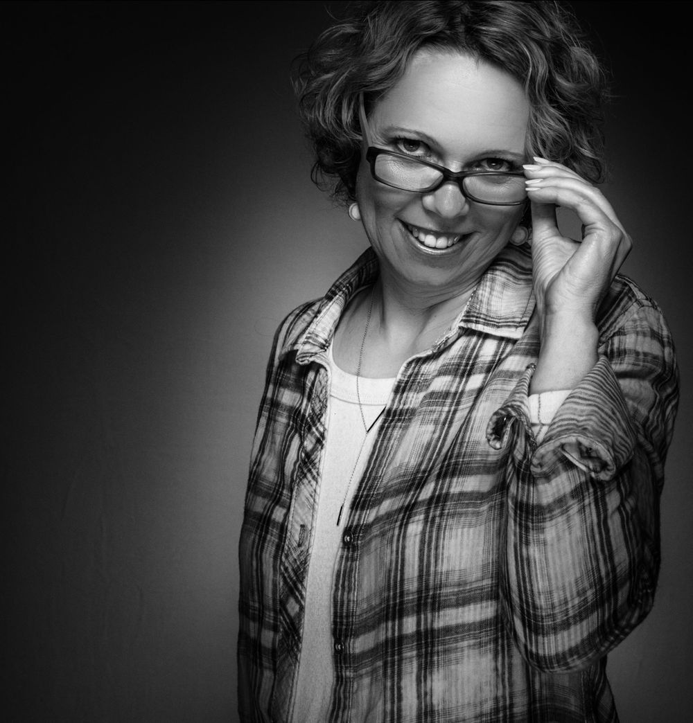 headshot of woman with glasses