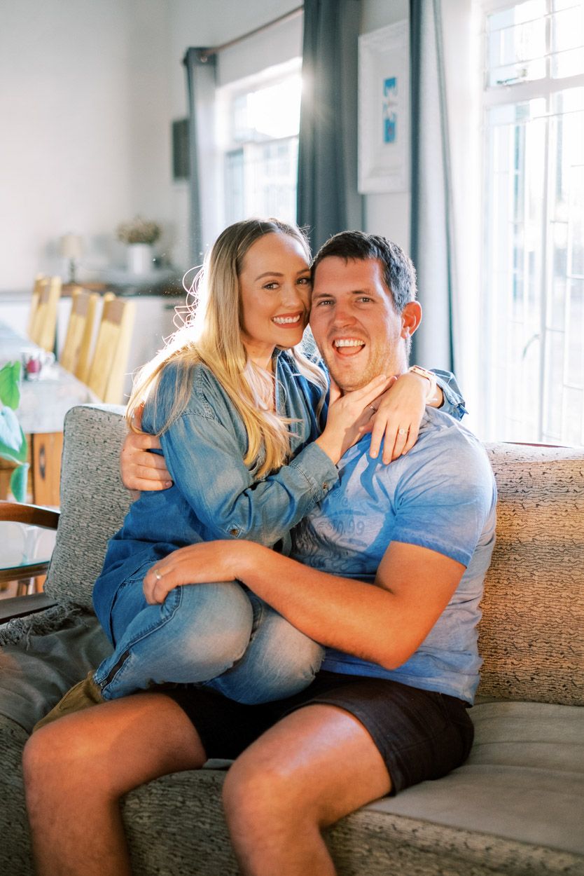 Couple embraces on a couch