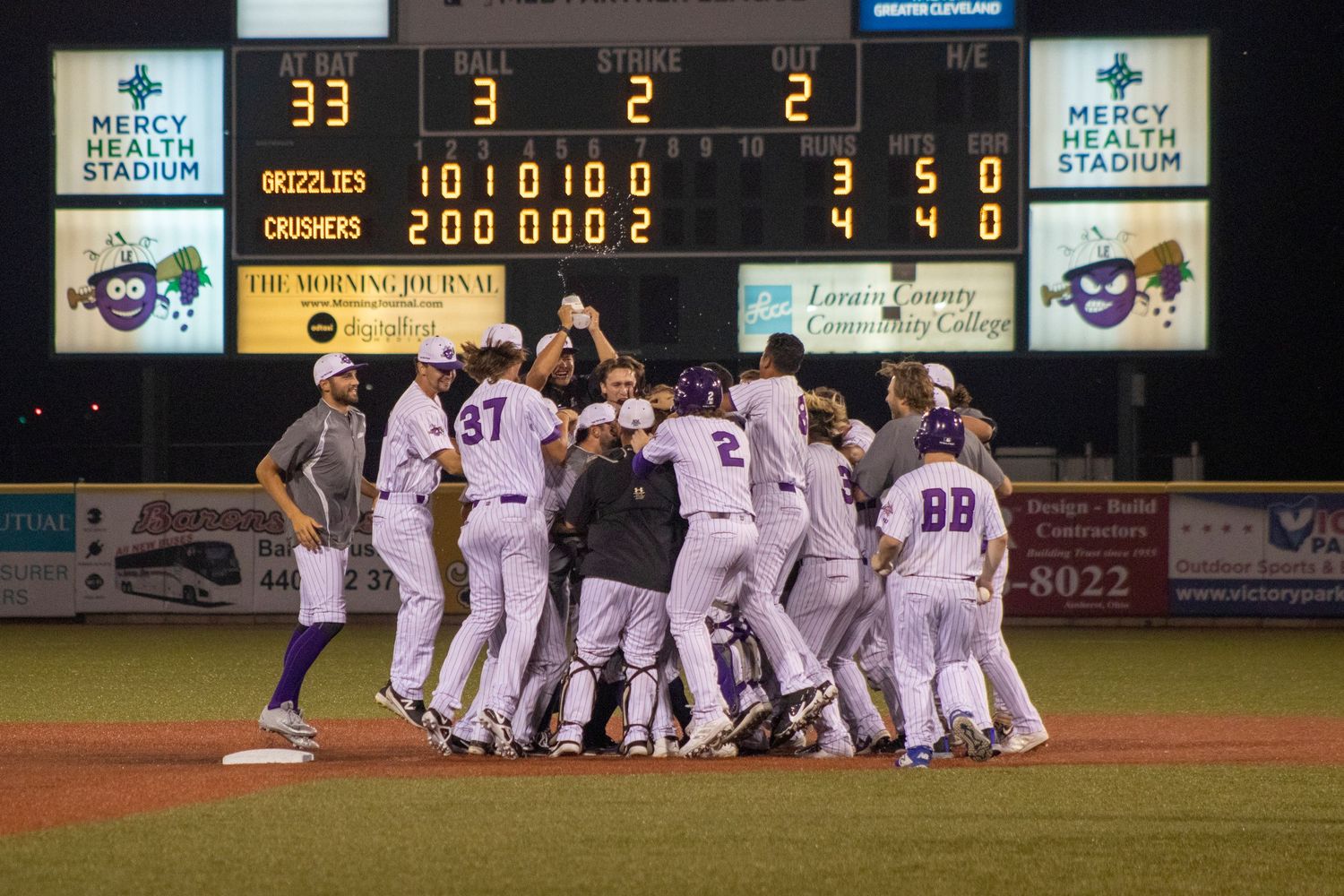 Baseball team celebrating a win.