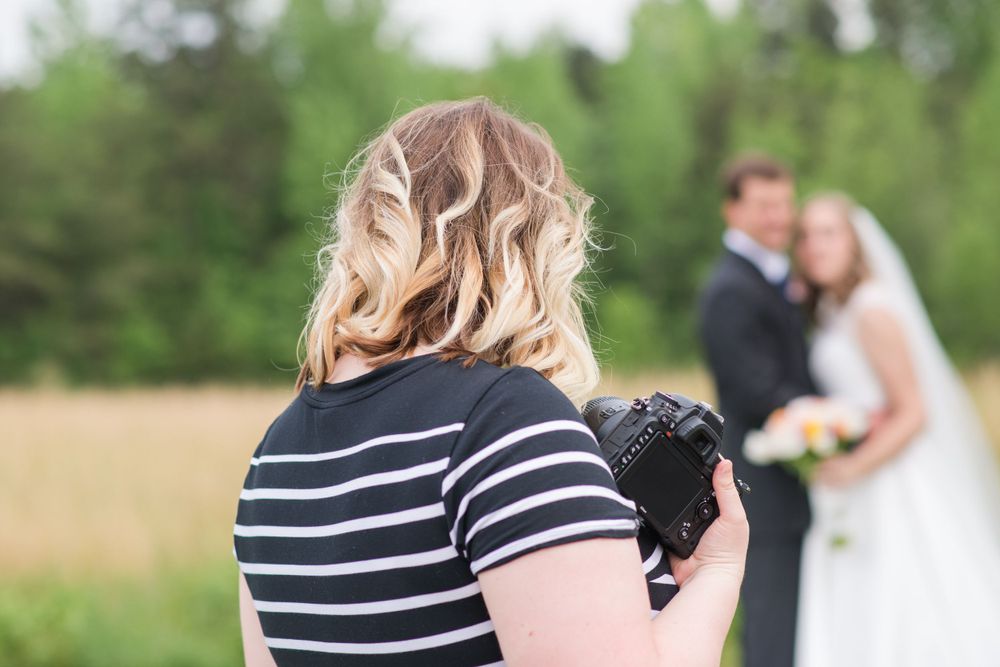 Outdoor wedding photography session in green natural setting.
