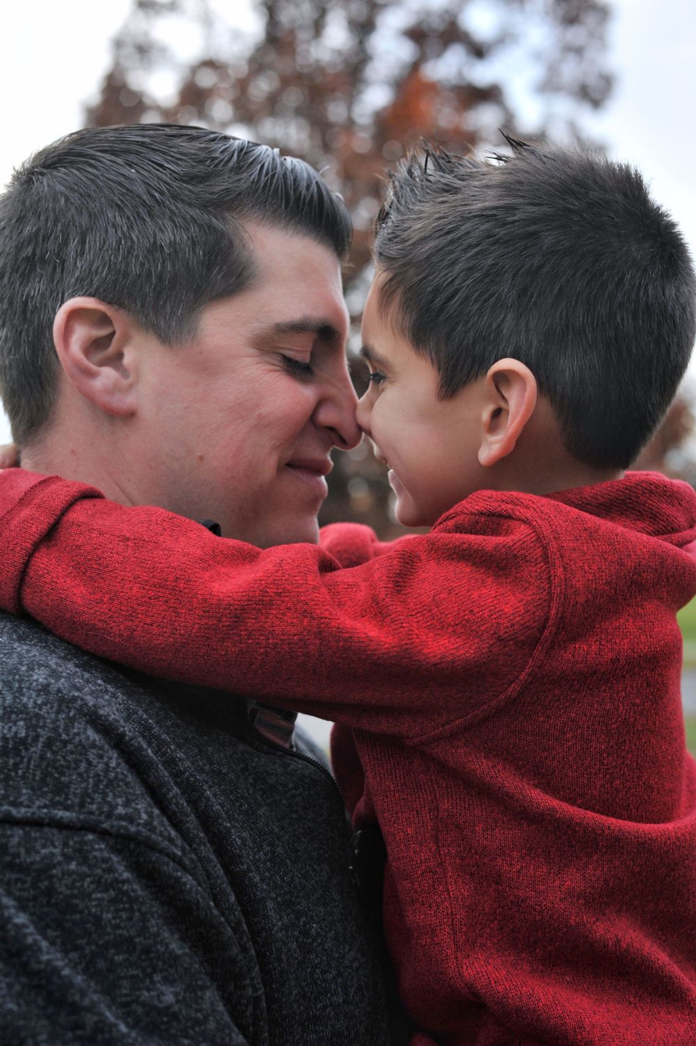 Father and son, nose to nose portrait