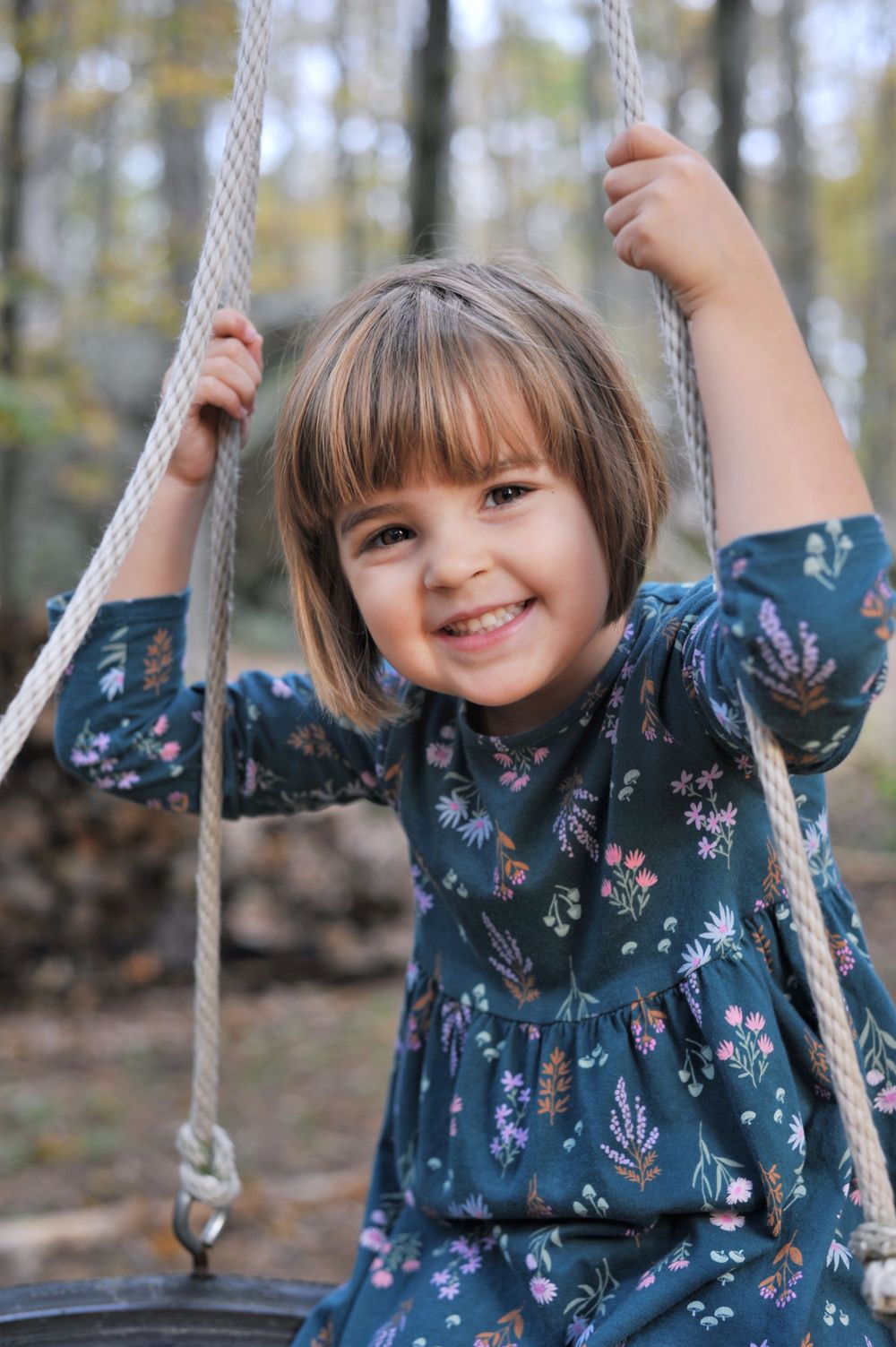 Girl portrait on tire swing