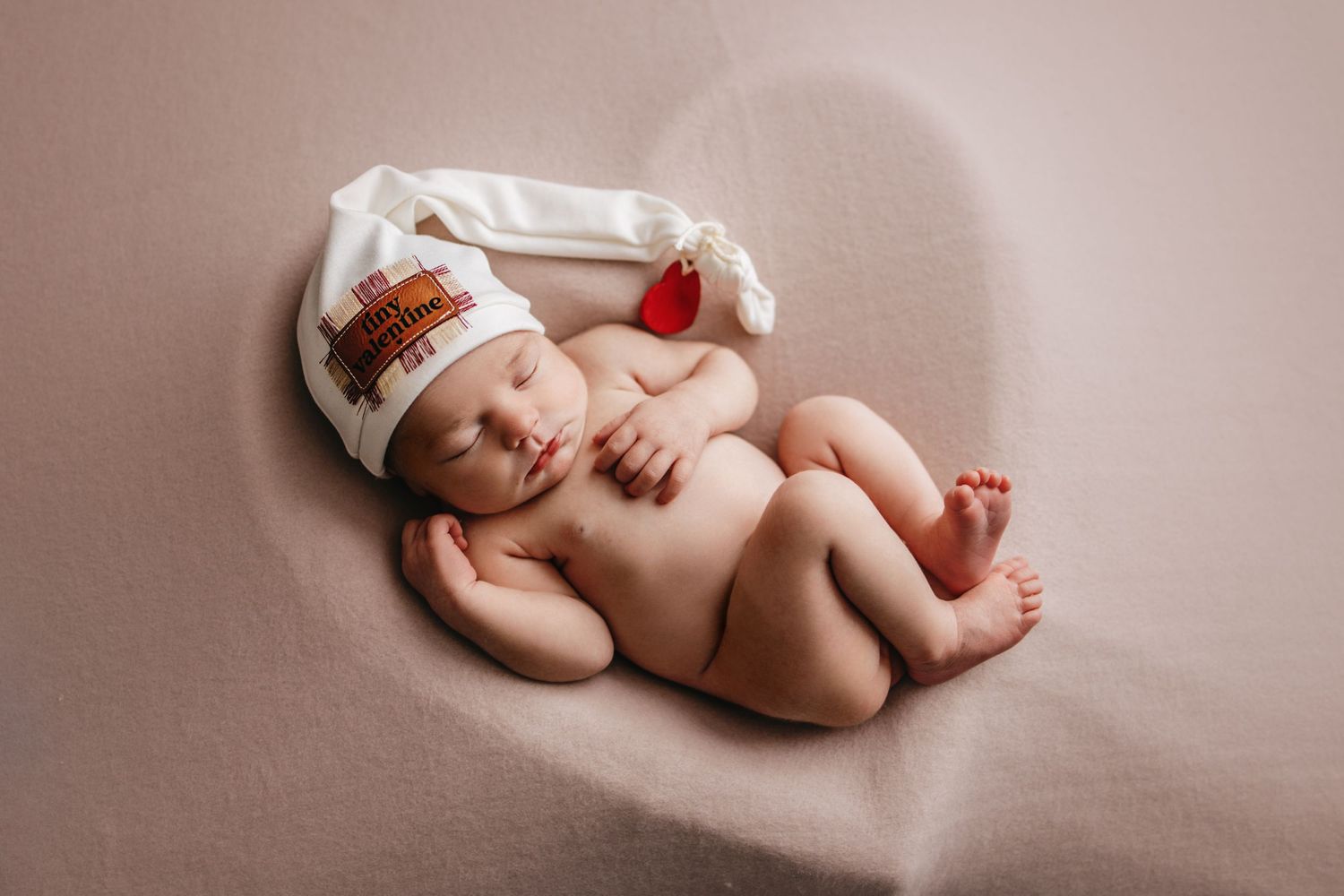 baby in heart bowl newborn photographer