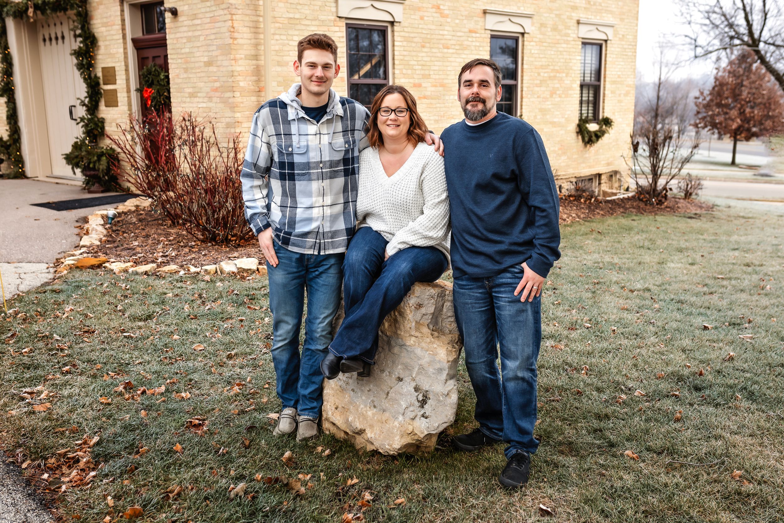 Casual family group portrait on stone bench outside historic brick building.
Janesville, WI
Brodhead, WI