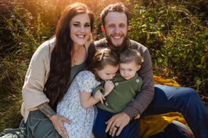Family portrait outdoors with golden sunset lighting in natural setting.
Janesville, WI
Brodhead, WI