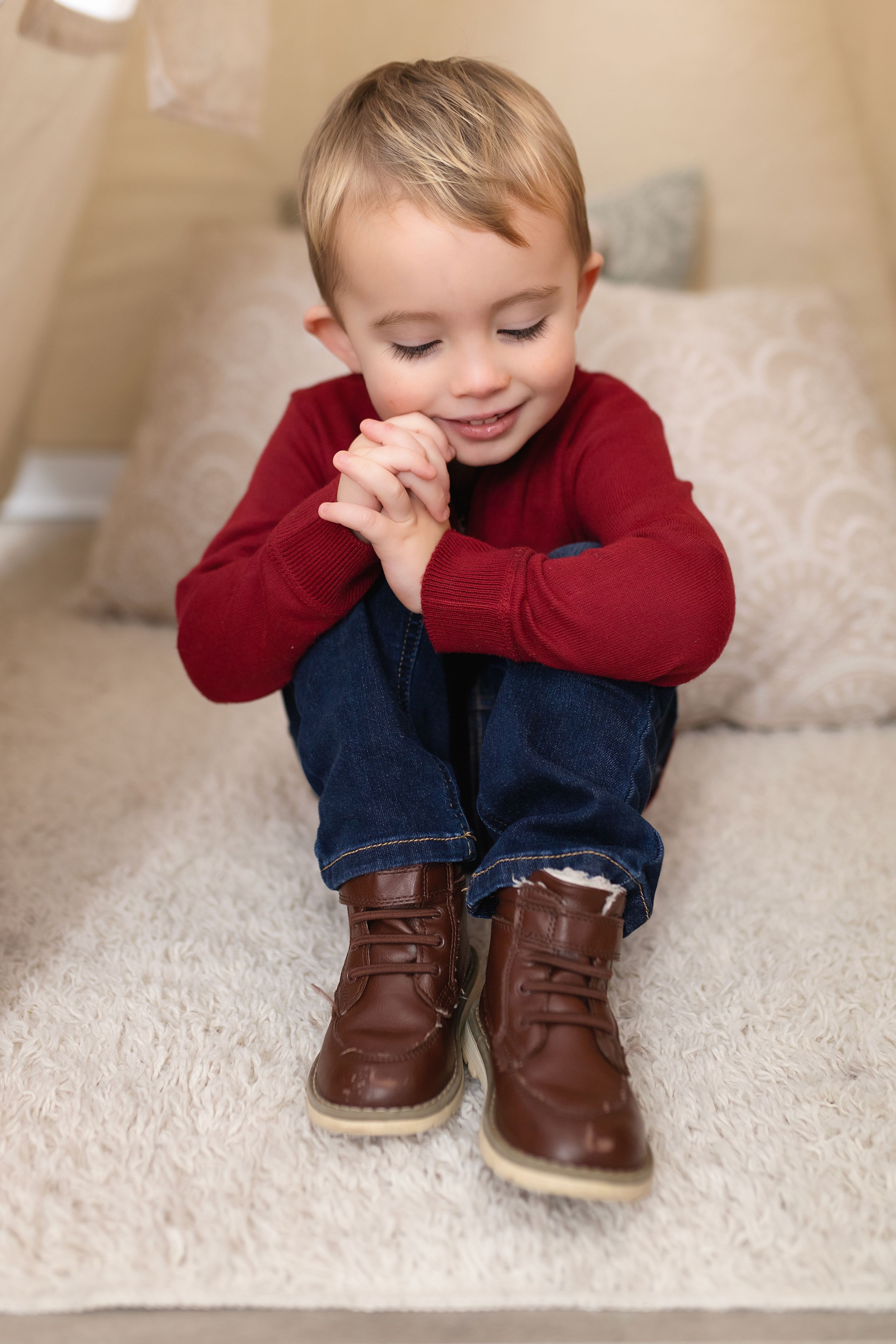 Young child in red sweater and brown boots sitting on light colored couch.
Janesville, WI
Brodhead, WI