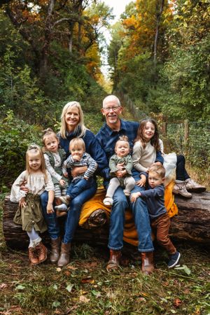 Group photo on fallen log in wooded area with orange blanket and fall foliage.
Janesville, WI
Brodhead, WI
