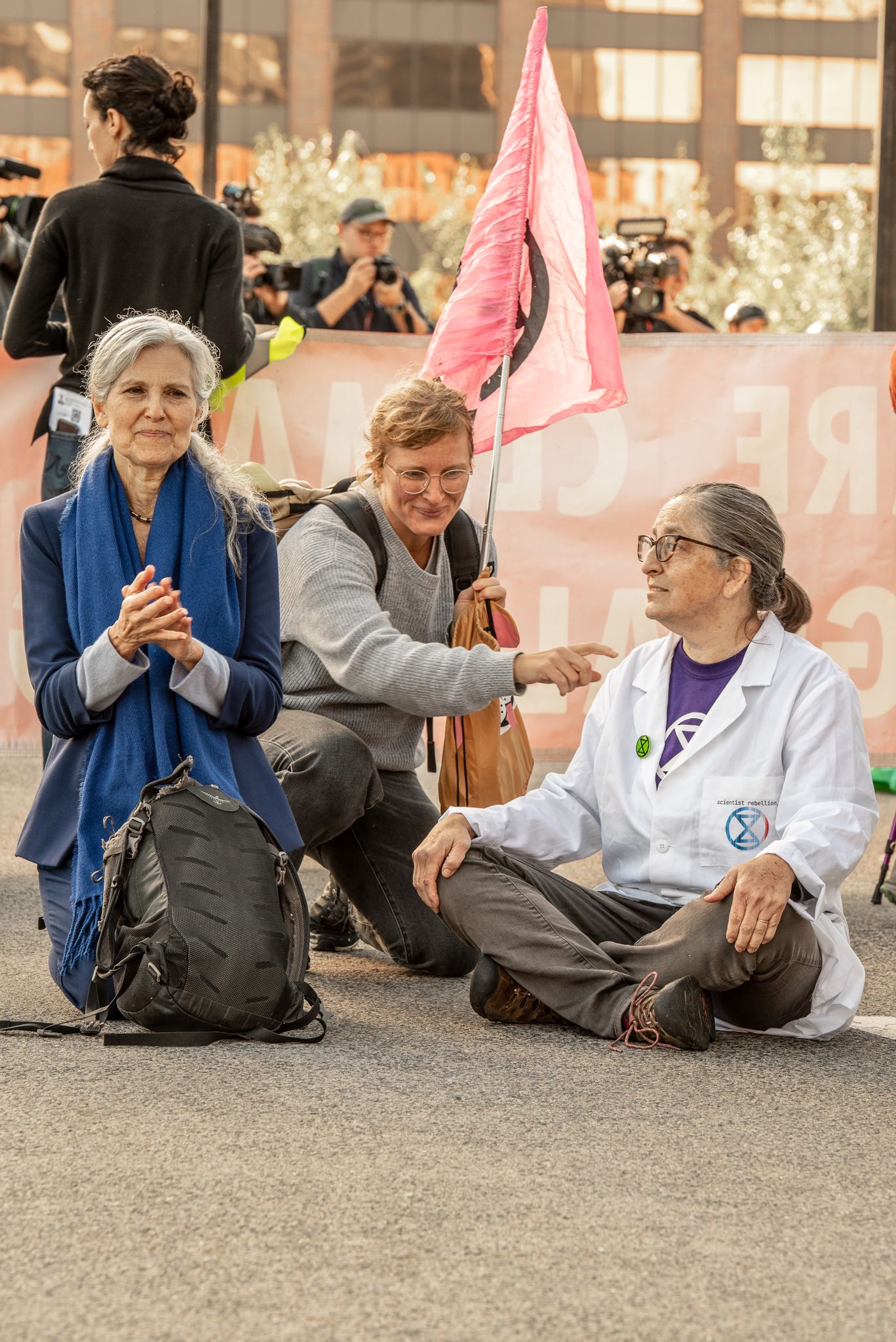 Dr. Jill Stein, climate activist, & climate scientist Pam DiBona on Seaport Blvd Bridge at Extinction Rebellion protest