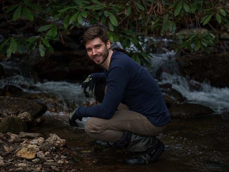 Shope Creek Rd Asheville NC Virtually Calhoun hiking in river and posing for photo