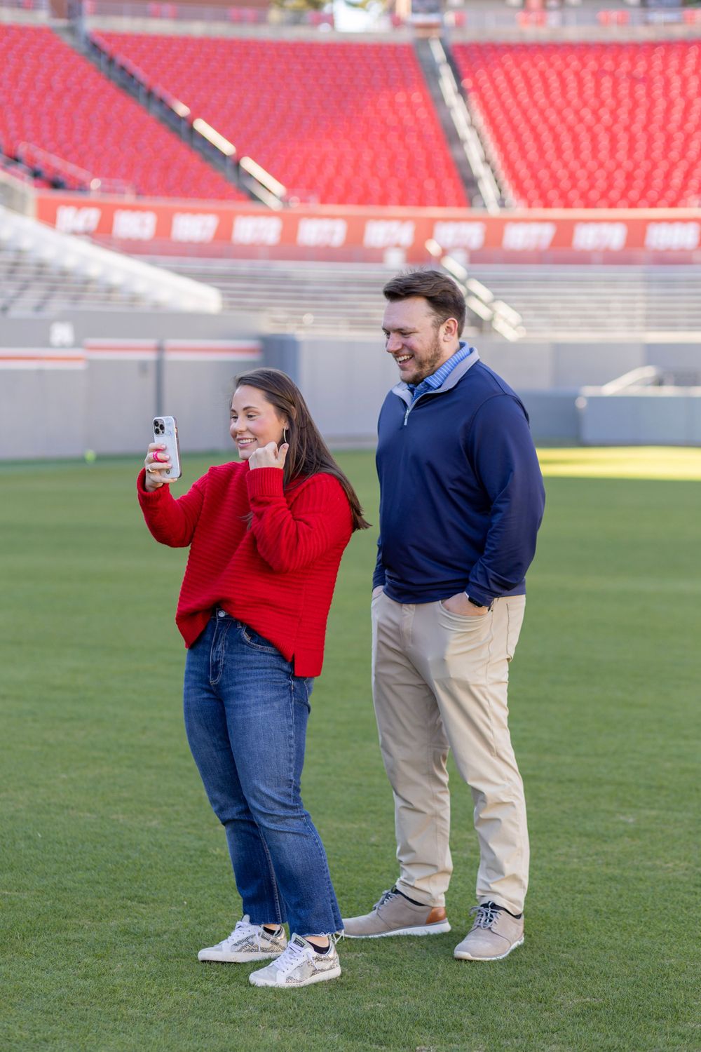 A couple facetimes after getting engaged at Carter Finley Stadium.