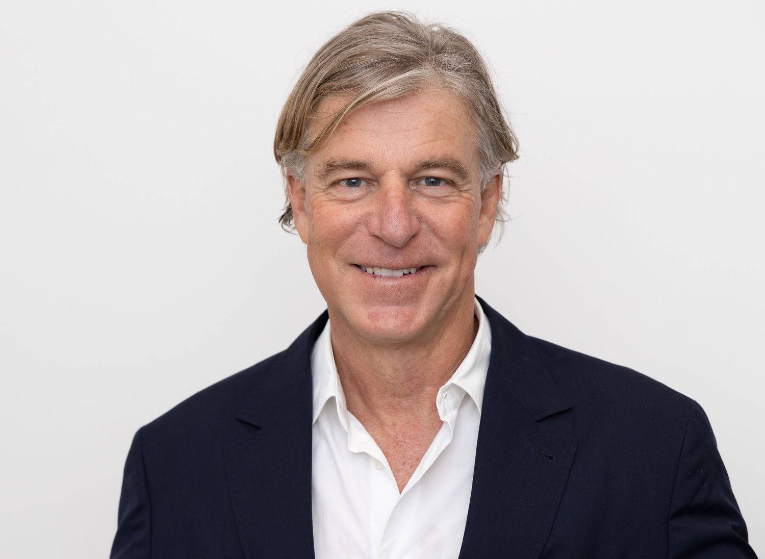Professional headshot against white background.