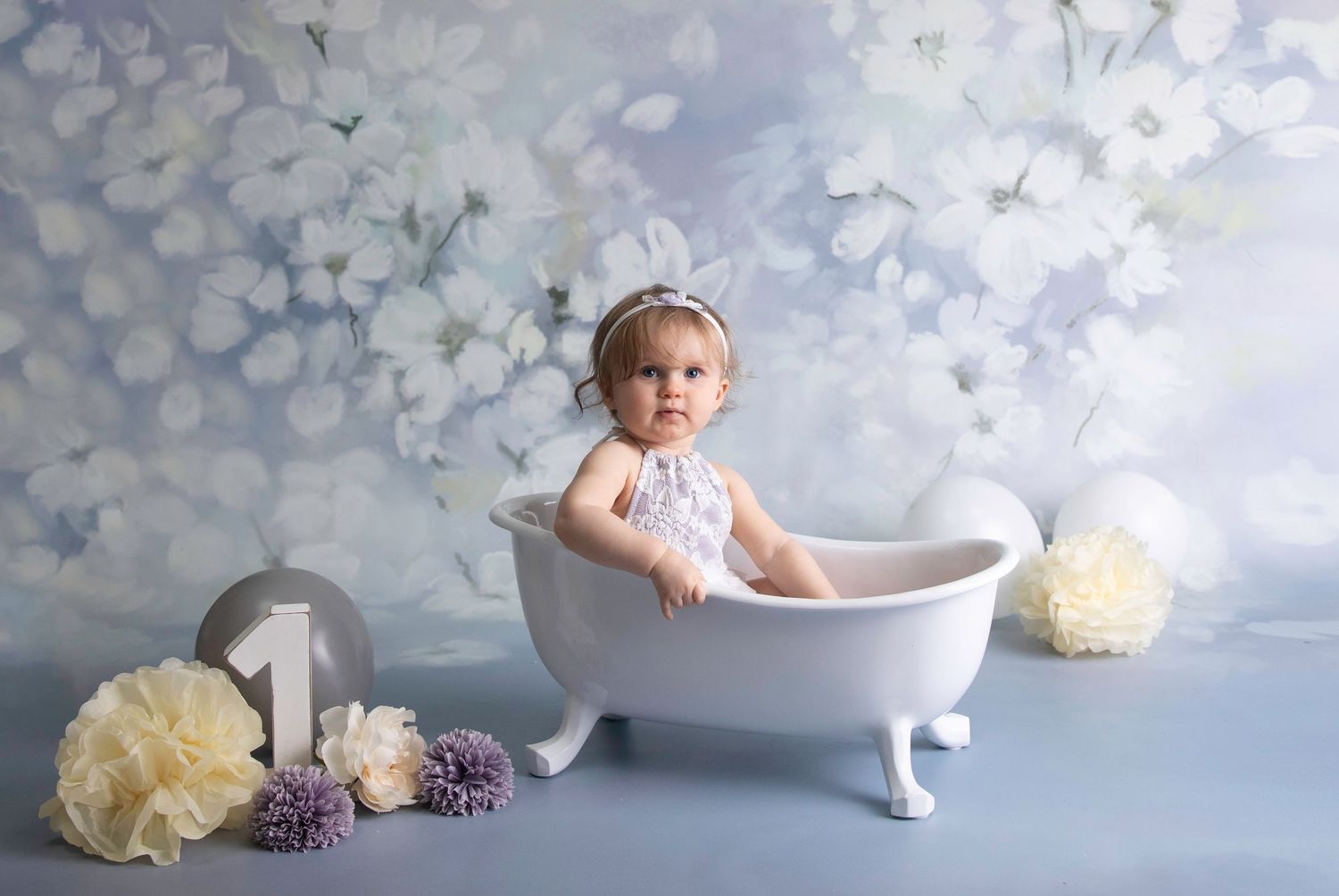 1 year cake smash victorian bath splash, blue/ grey floral backdrop white wooden no.1 cream grey & blue accessories.