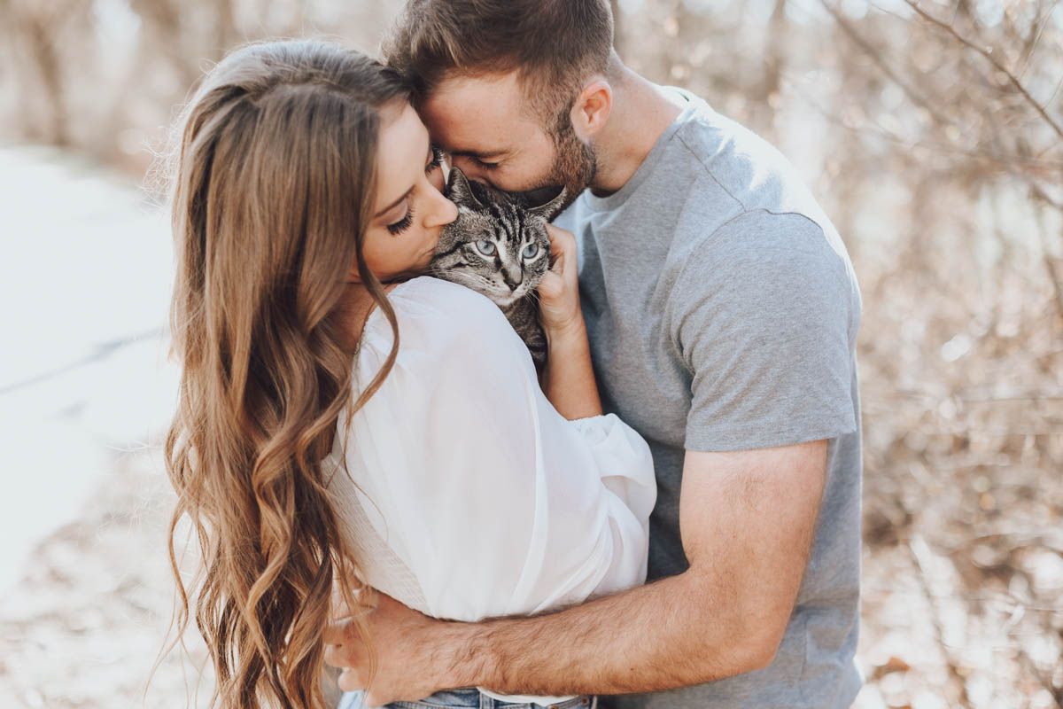 Romantic couple poses together in a series of intimate outdoor portrait shots.