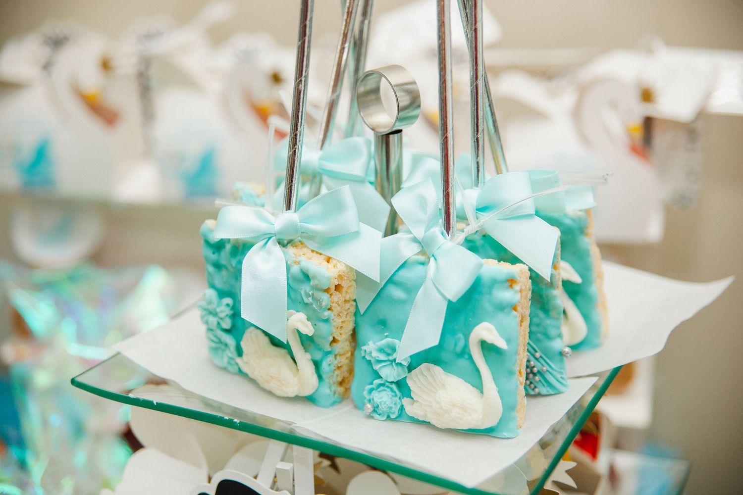 Mint green and white party decorations with elegant table settings.