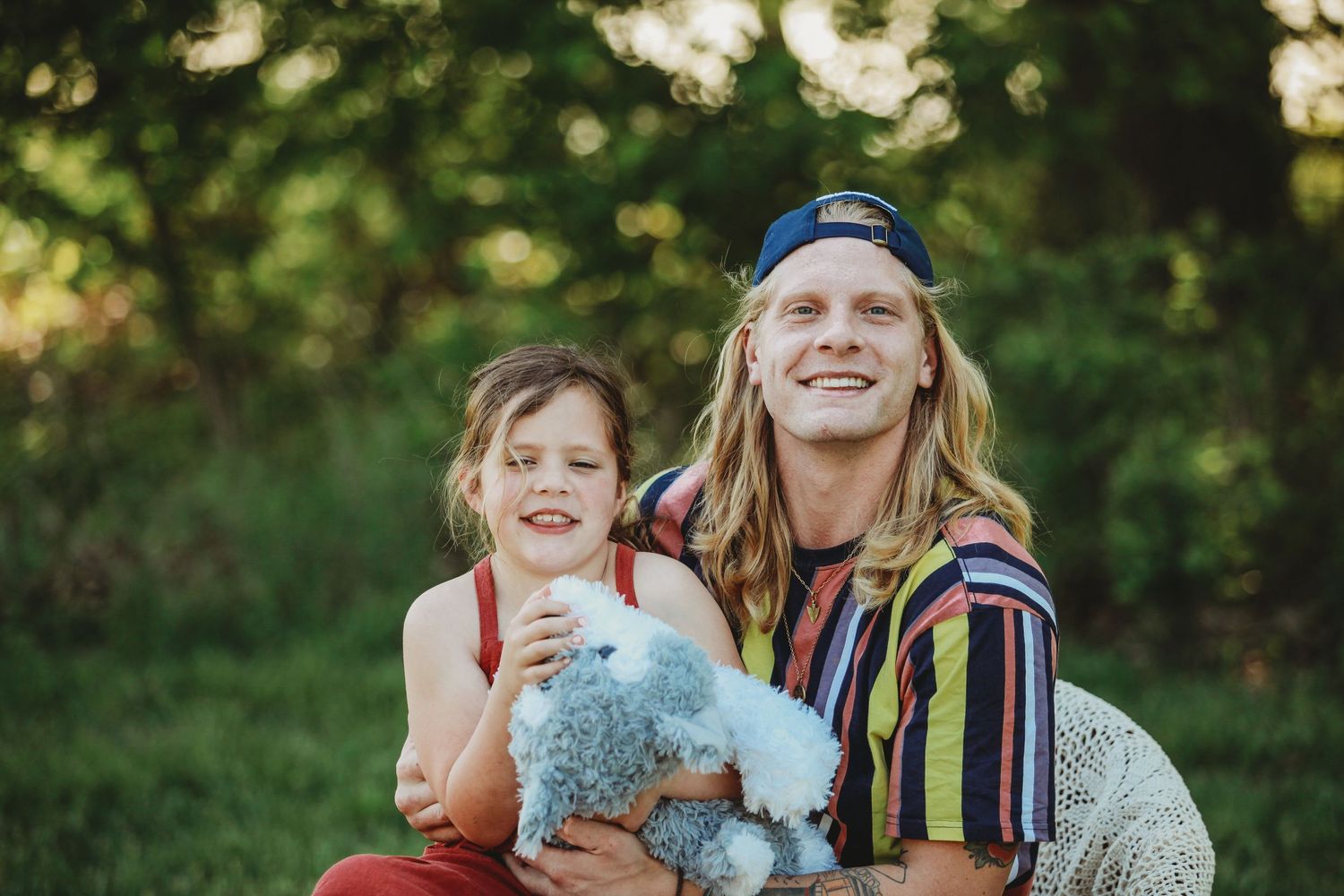Candid family moments captured in golden evening light outdoors.