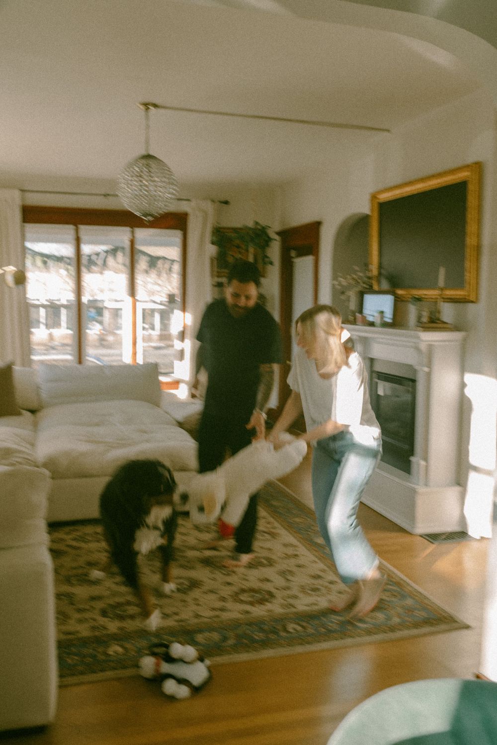 in home couples session with dog, in Grand Rapids michigan. cozy in home session. filmy family photos.