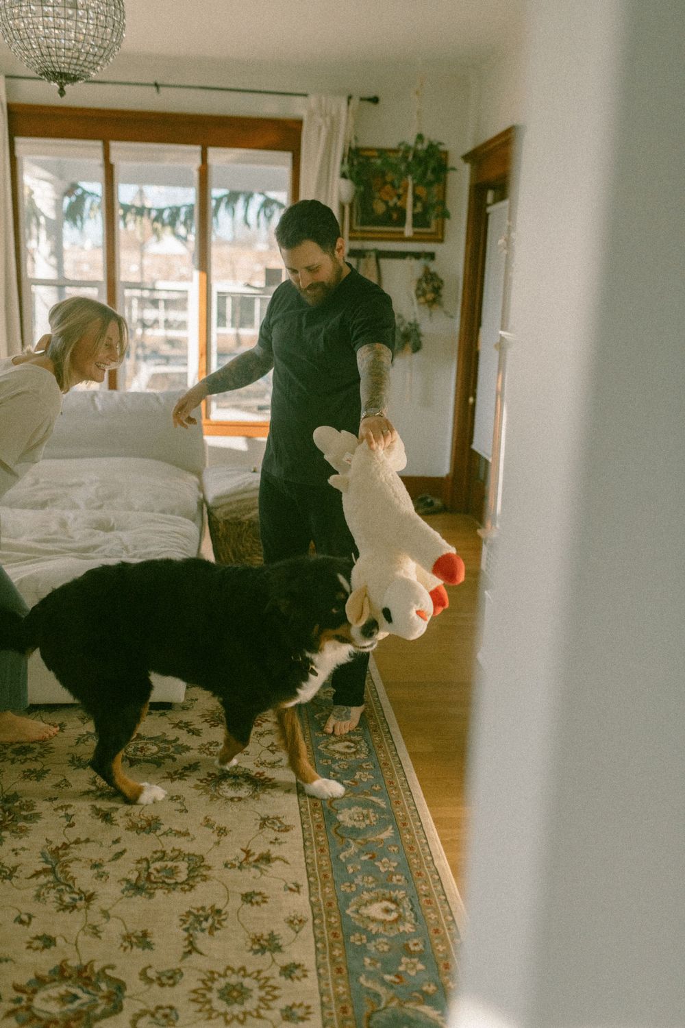 in home couples session with dog, in Grand Rapids michigan. cozy in home session. filmy family photos.