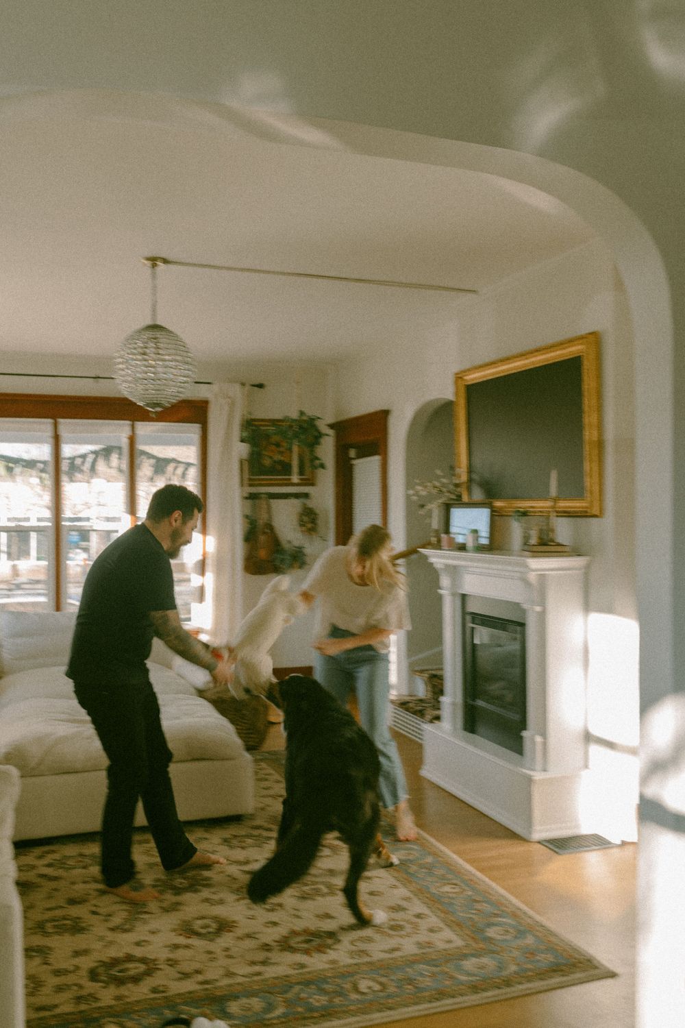in home couples session with dog, in Grand Rapids michigan. cozy in home session. filmy family photos.