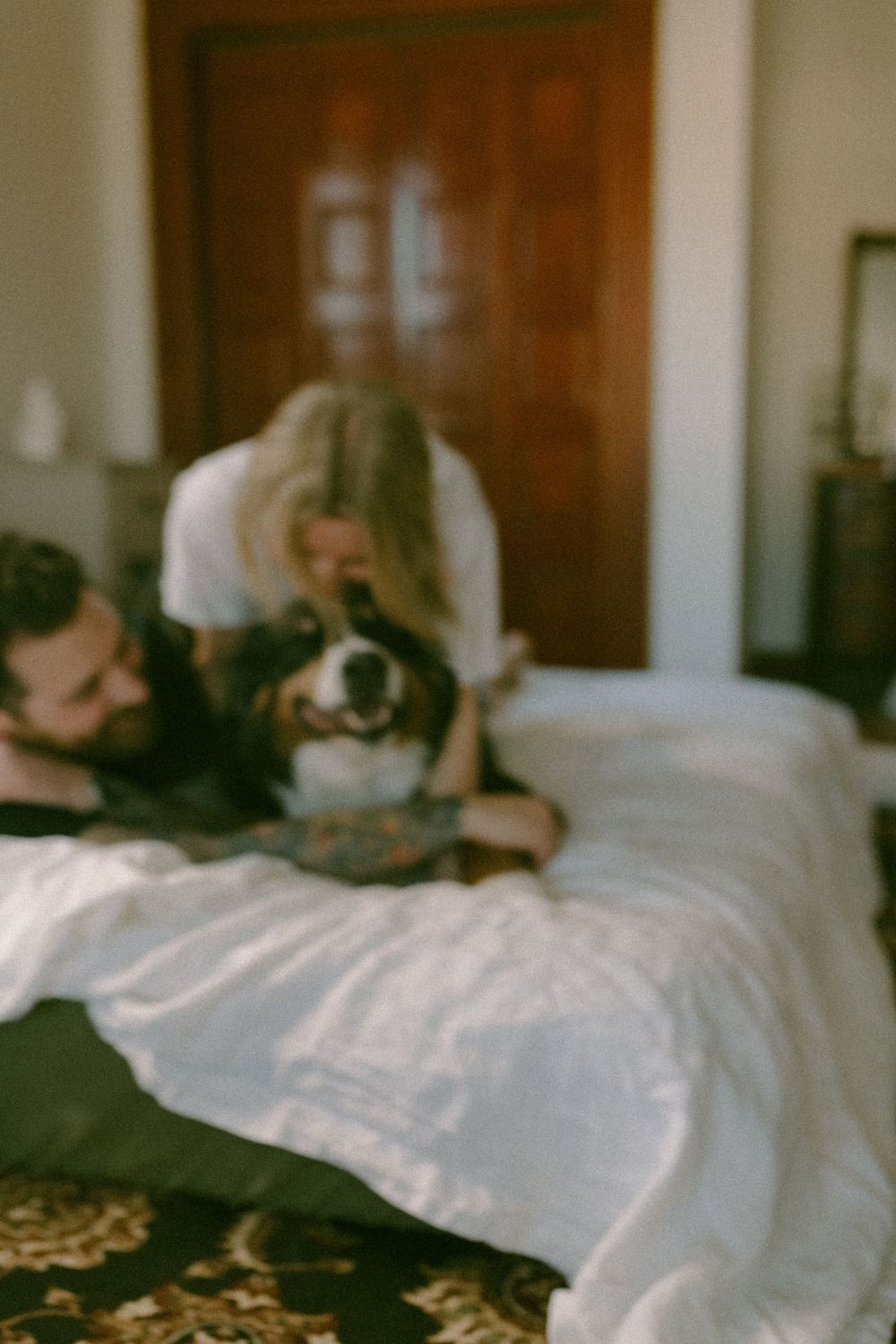 in home couples session with dog, in Grand Rapids michigan. cozy in home session. filmy family photos.