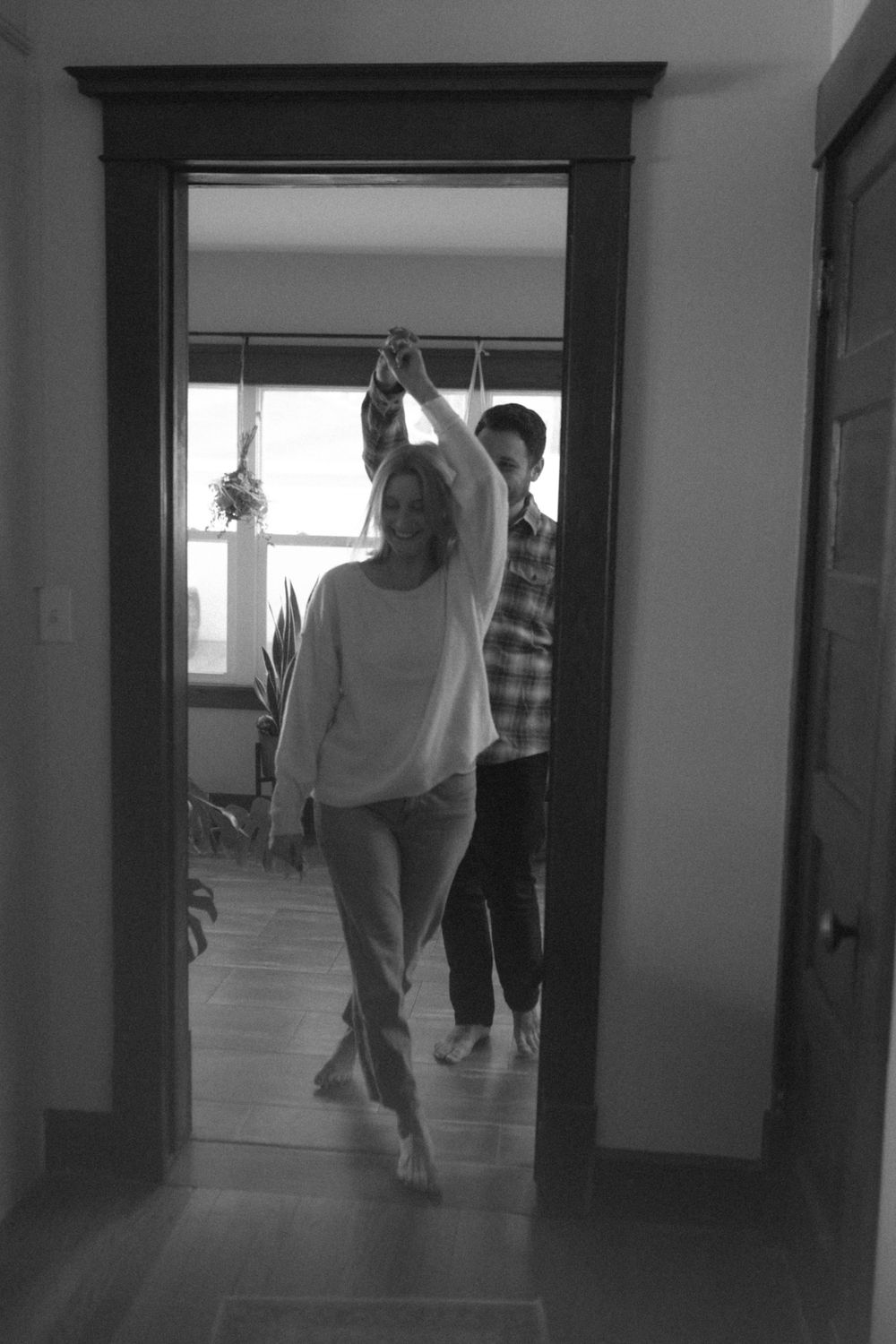 in home couples session with dog, in Grand Rapids michigan. cozy in home session. filmy family photos.