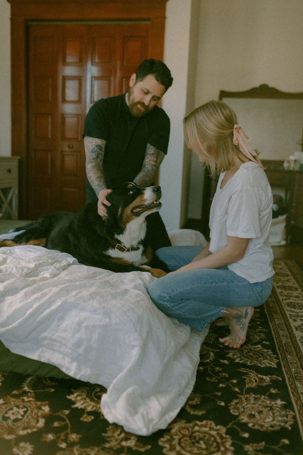 in home couples session with dog, in Grand Rapids michigan. cozy in home session. filmy family photos.