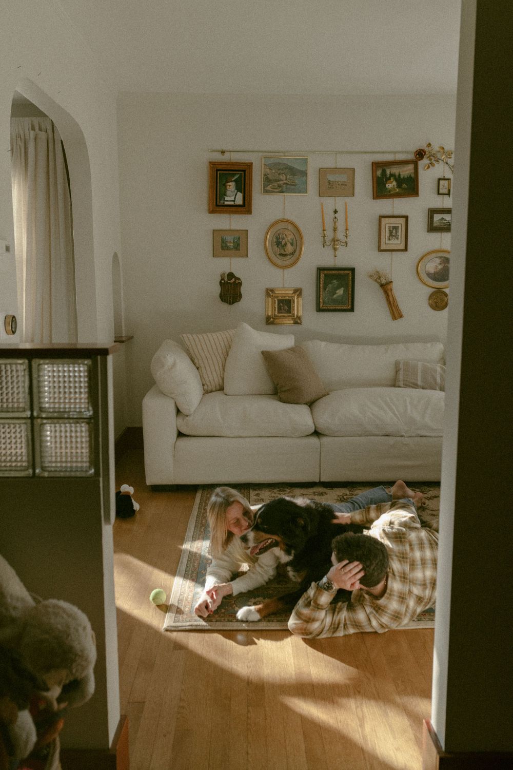 in home couples session with dog, in Grand Rapids michigan. cozy in home session. filmy family photos.