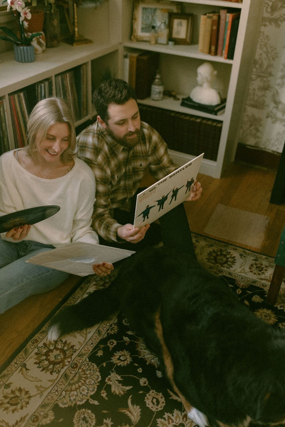 in home couples session with dog, in Grand Rapids michigan. cozy in home session. filmy family photos.