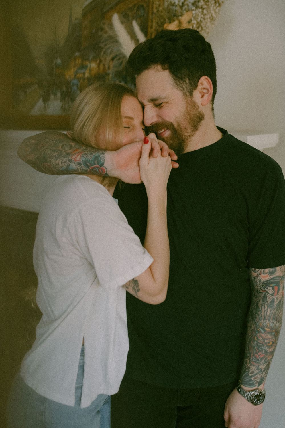 in home couples session with dog, in Grand Rapids michigan. cozy in home session. filmy family photos.