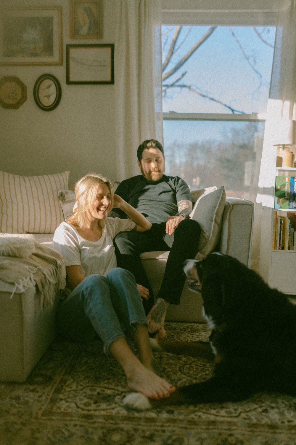 in home couples session with dog, in Grand Rapids michigan. cozy in home session. filmy family photos.