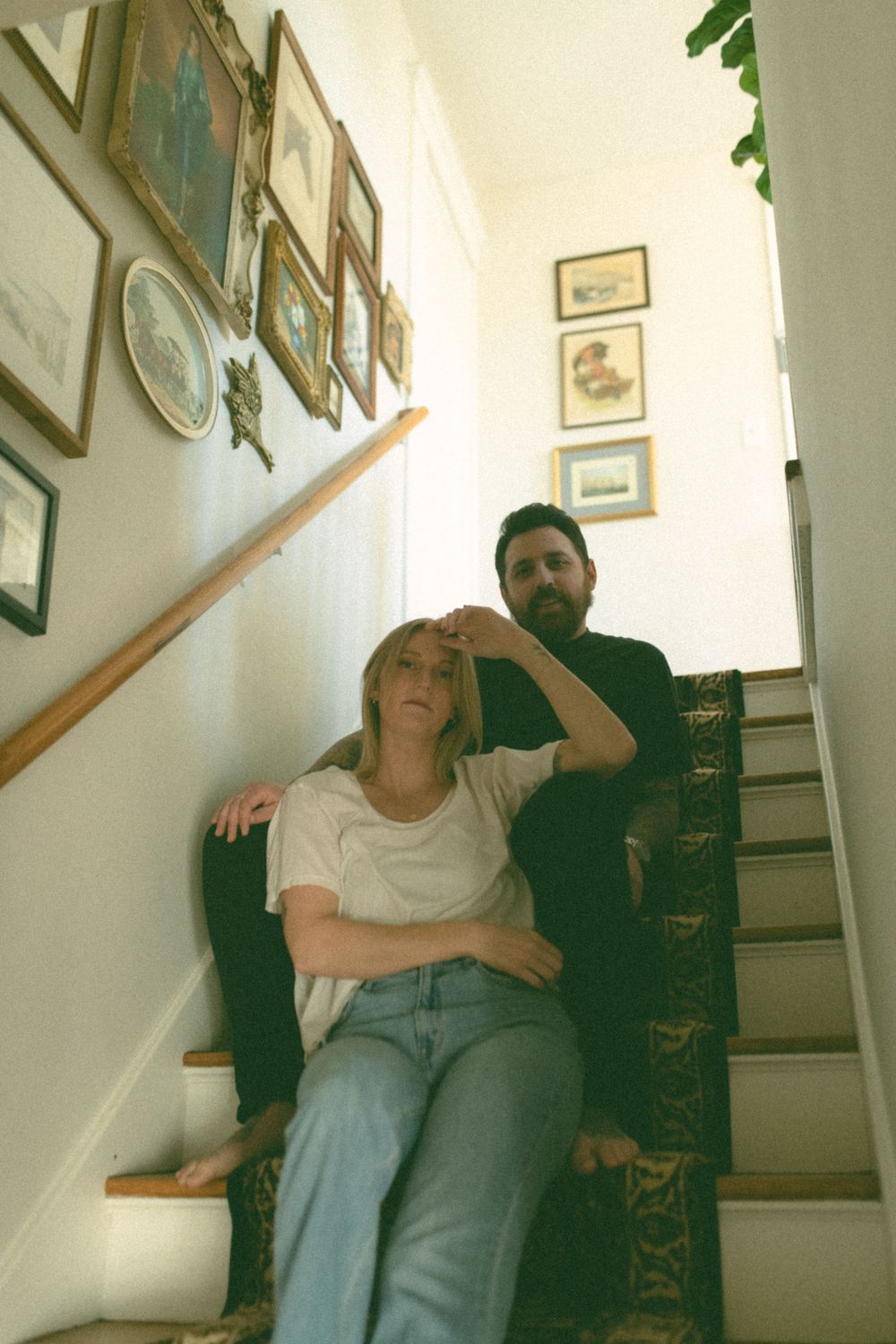in home couples session with dog, in Grand Rapids michigan. cozy in home session. filmy family photos.