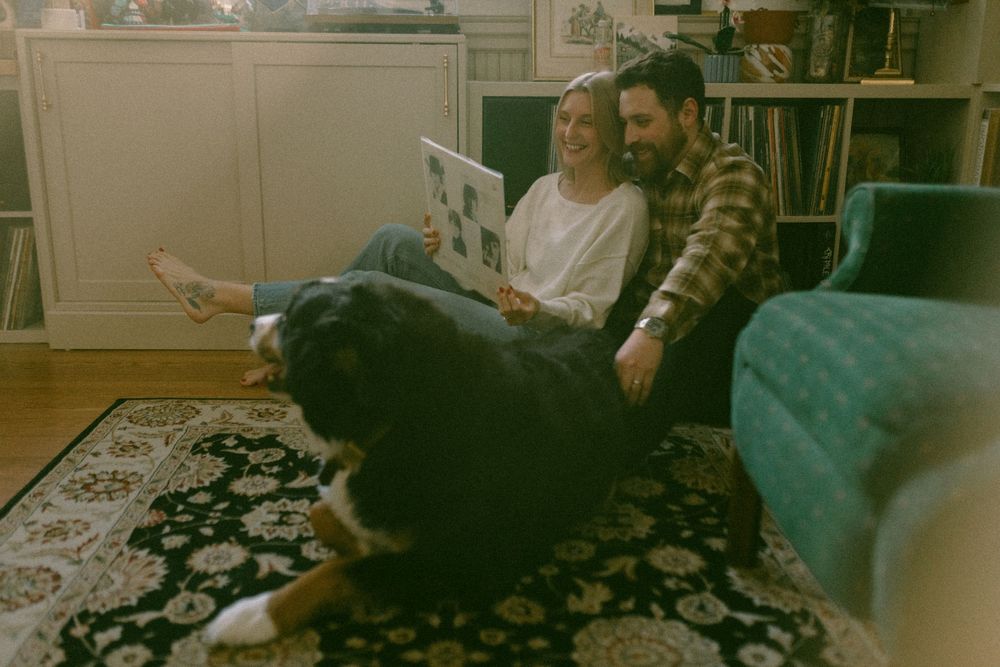 in home couples session with dog, in Grand Rapids michigan. cozy in home session. filmy family photos.