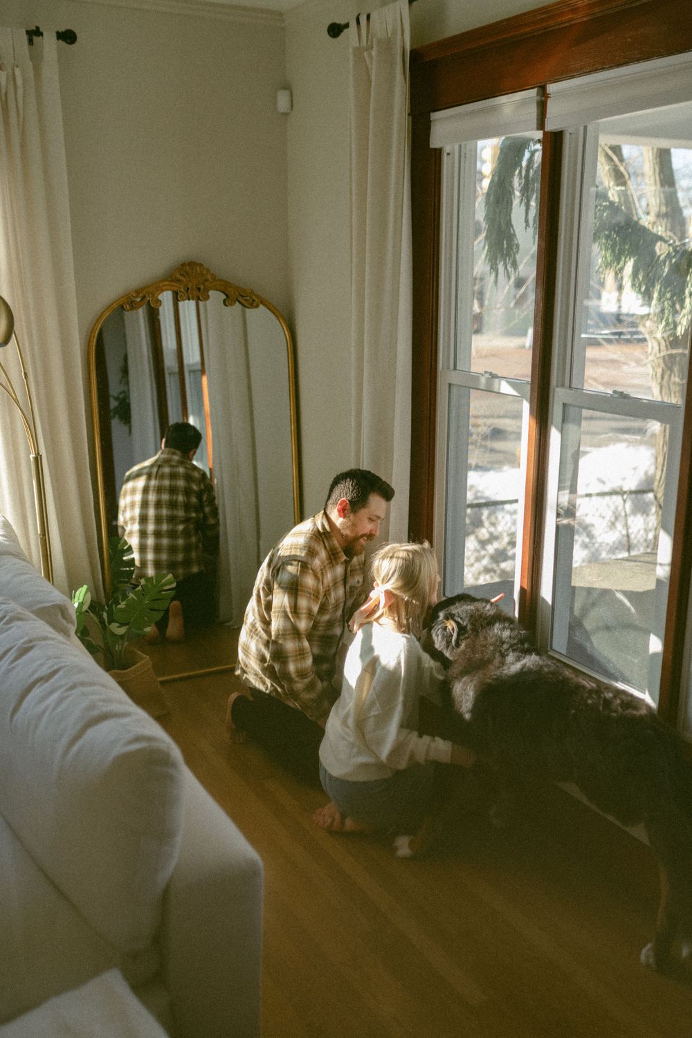 in home couples session with dog, in Grand Rapids michigan. cozy in home session. filmy family photos.