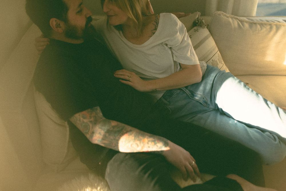 in home couples session with dog, in Grand Rapids michigan. cozy in home session. filmy family photos.