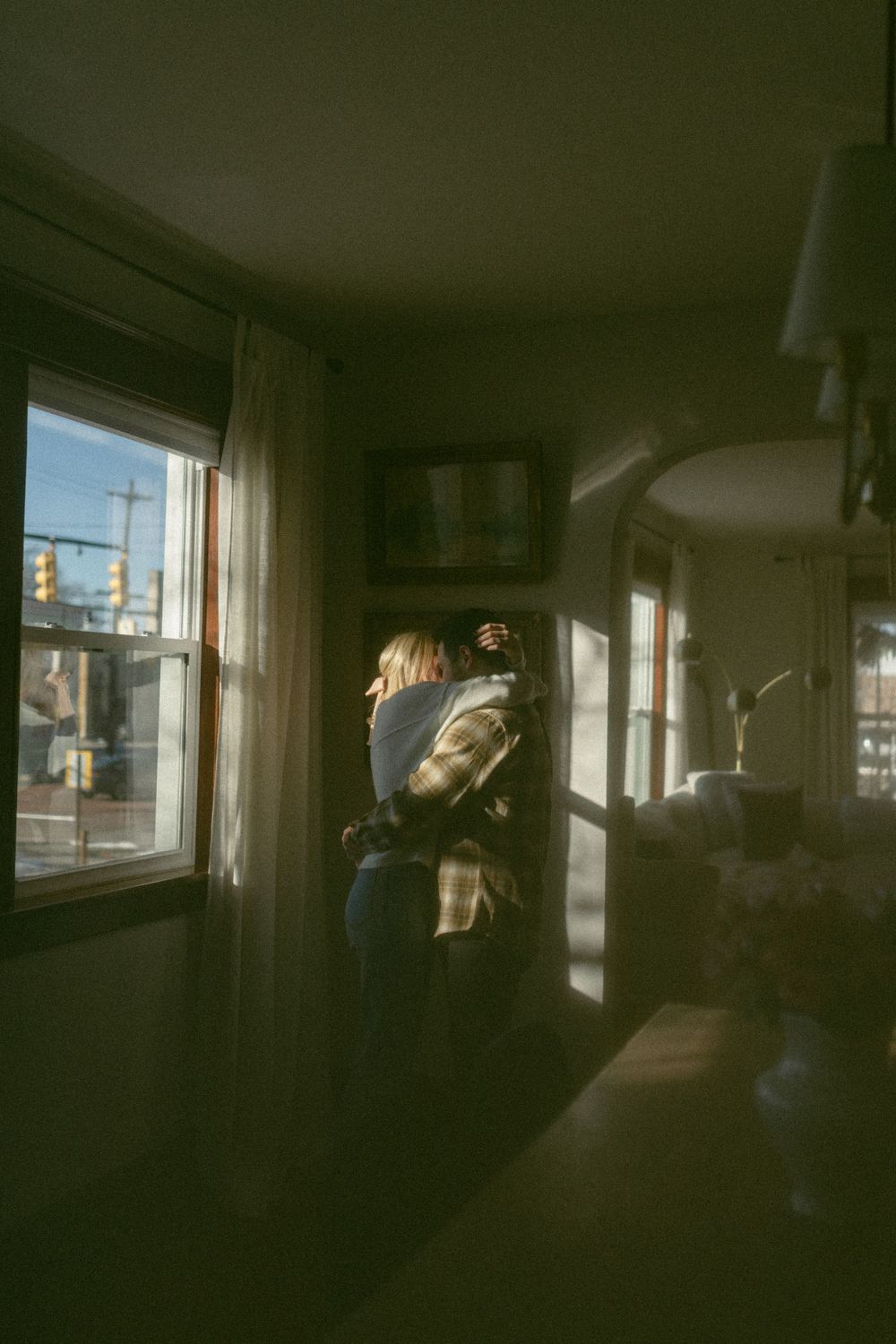 in home couples session with dog, in Grand Rapids michigan. cozy in home session. filmy family photos.