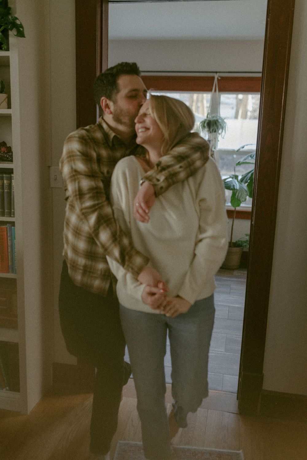 in home couples session with dog, in Grand Rapids michigan. cozy in home session. filmy family photos.