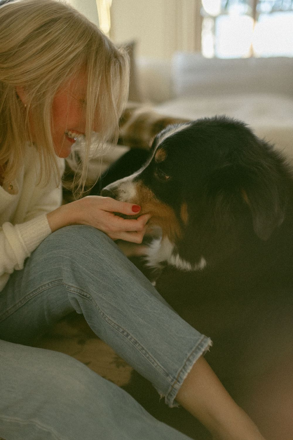 in home couples session with dog, in Grand Rapids michigan. cozy in home session. filmy family photos.