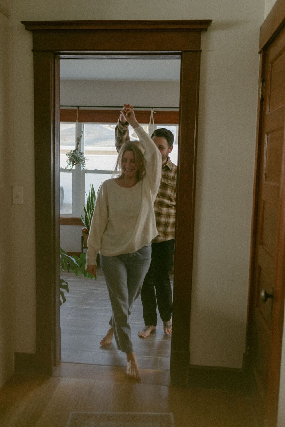 in home couples session with dog, in Grand Rapids michigan. cozy in home session. filmy family photos.