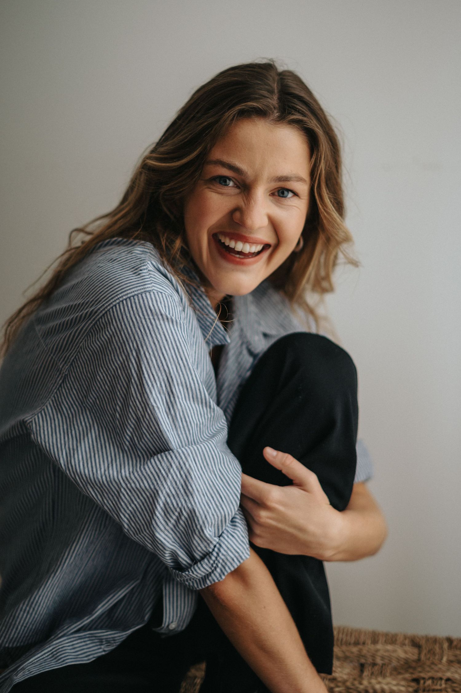 Lifestyle portraits featuring striped shirt and casual poses against white background.