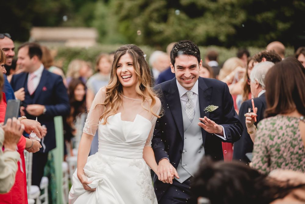 Wedding celebration captures joyful dancing and celebration moments outdoors.